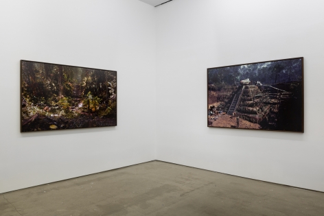 An installation view of Jasper de Beijer's exhibition, "The Brazilian Suitcase". Framed photographs are on the walls.