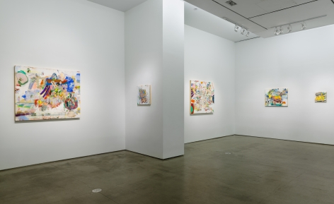 Installation image of Carolyn Case's solo exhibition. Paintings line the gallery walls by a column