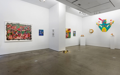 Installation view of ALIVE WITH PLEASURE!, which features a mix of artworks on hung on the walls and sculptures on pedestals and on the floor.